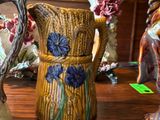 three vases that are sitting on a table