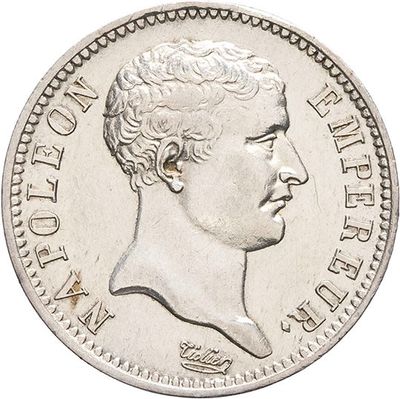 a close up of a coin with a man ' s face on it
