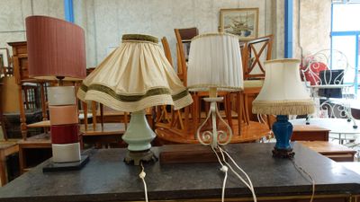 two lamps that are on a table in a room