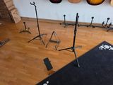 a room with guitars and other musical equipment on the floor