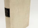 a white book with a black label on it