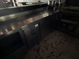 an image of a kitchen with a large painting on the wall