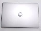 a laptop that is sitting on a white table