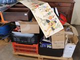 a pile of boxes and boxes on a pallet in a room
