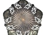 a silver plate that has a bunch of silver spoons in it