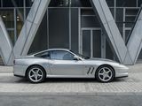 a silver sports car parked on the side of the street