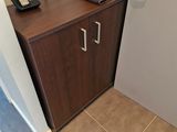 a small cabinet with a phone on top of it