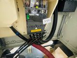 a close up of a machine with wires and wires attached to it
