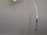 a lamp that is sitting on the floor next to a keyboard