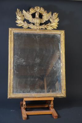 a mirror that is on a stand with a mirror on it
