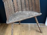 a wooden bench that is sitting on a hard wood floor