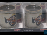 packaging of two coffee mugs in a clear box on a black background