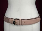 a close up of a mannequin torso with a belt on it