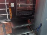 an oven that is sitting in the corner of a room