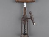 a bottle opener with a wooden handle on a gray background
