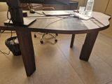 a desk with a laptop and a water bottle on it