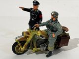two figurines of a man on a motorcycle and a man on a motorcycle