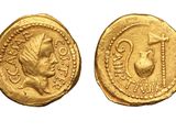 a gold coin with an image of a man and a woman on it