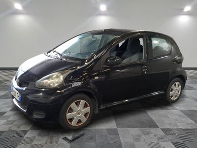 a picture of a small black car on a checkered floor
