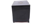 a small black cabinet with a drawer on it