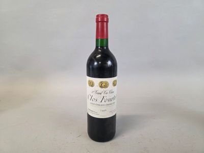 a bottle of wine that is sitting on a table
