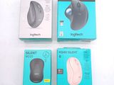 three boxes of mouses sitting on top of a white surface