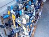 many different types of valves lined up on a pallet