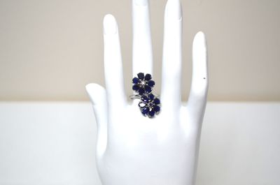 an image of a hand with a ring on it ' s finger
