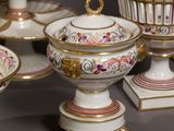 many plates and bowls that are on a table