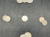 a lot of coins that are on the table