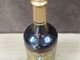a bottle of wine that is sitting on a table