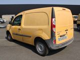 a yellow van that is parked in a parking lot