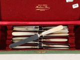 six knives in a box with a knife in it