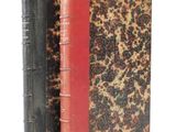 two books that are sitting side by side on a white surface