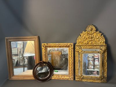 three mirrors and a mirror on a shelf