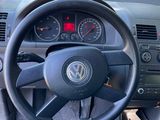 dashboard of a car with a steering wheel and dashboard gauges