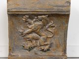 a close up of a stone planter with a bird on it