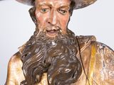 a statue of a man with a hat and a beard