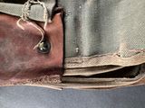 a close up of a bag with a button on it
