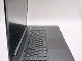 a laptop that is open on a white surface