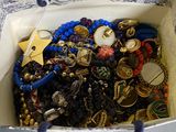 a bag full of jewelry sitting on a table