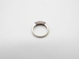 a close up of a ring on a white surface