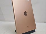 an image of a gold ipad sitting on top of a white table