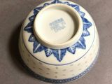 a blue and white vase sitting on a table