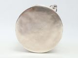 silver plated pocket watch with a chain on a white background