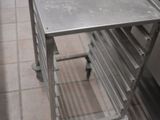 a metal table with a book on it in a kitchen
