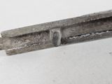 a piece of metal that has been cut in half