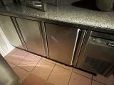 a kitchen with stainless steel appliances and granite counter tops
