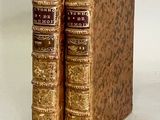 two books that are sitting side by side on a table