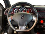 the interior of a car with a steering wheel and dashboard controls